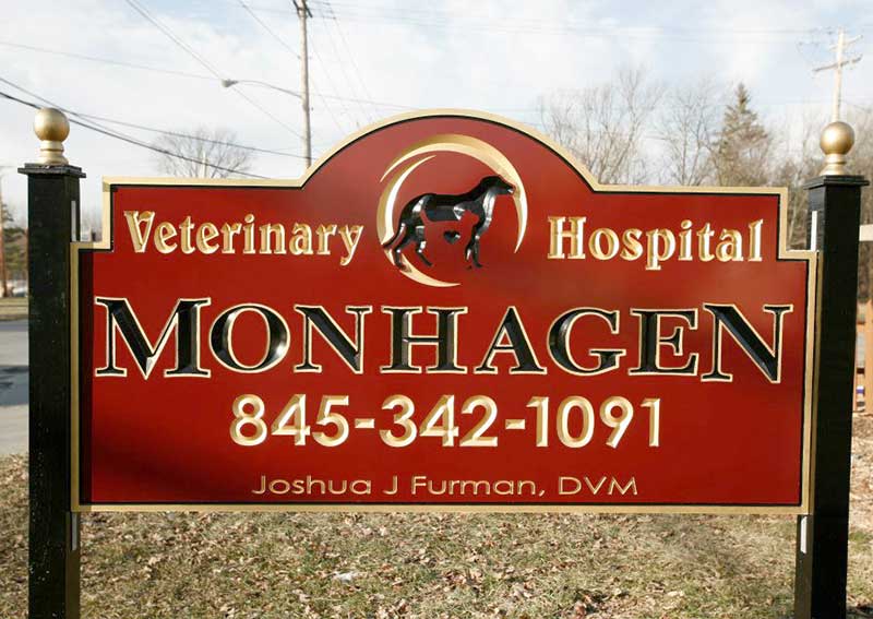 Carousel Slide 1: Monhagen Veterinary Hospital Exterior Sign